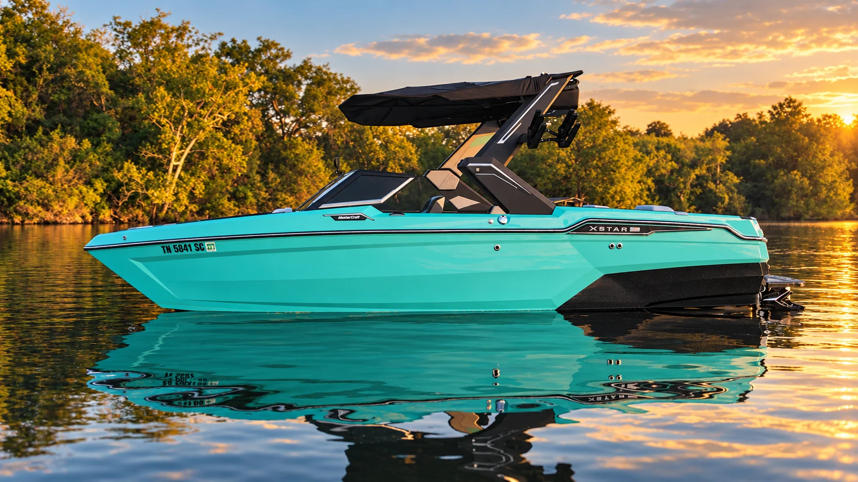 Turquoise MasterCraft in side profile on calm water at sunset